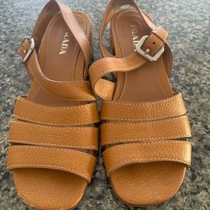 Prada size IT38 tan pebbled leather sandals with 1 1/4” heel covered in raffia